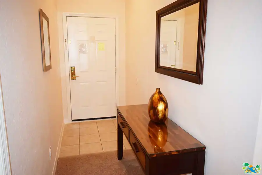 View of the table and mirror in the entrance hallway