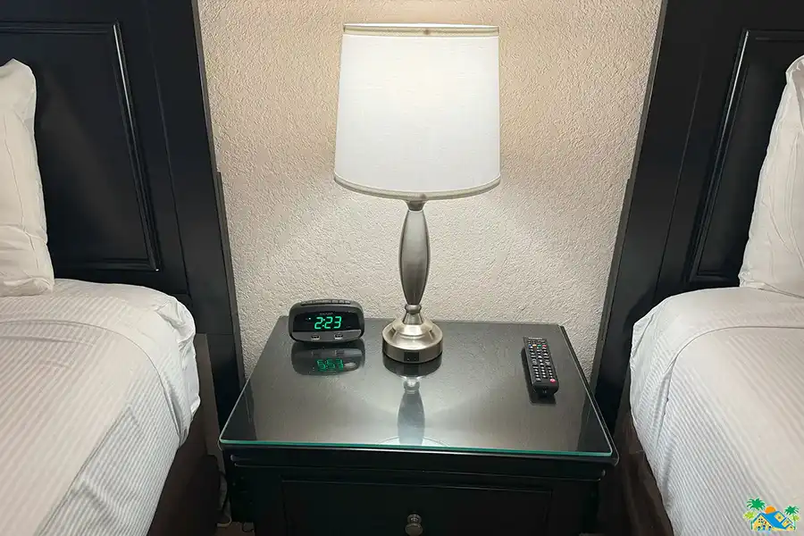 Twin bedroom bedside lamp and alarm clock, both with USB ports