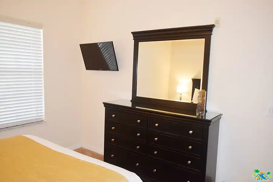 Queen guestroom chest of drawers, mirror and flat screen television