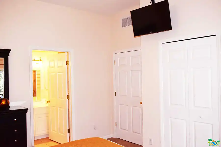 Master Bedroom looking from the balcony doors towards the en-suite