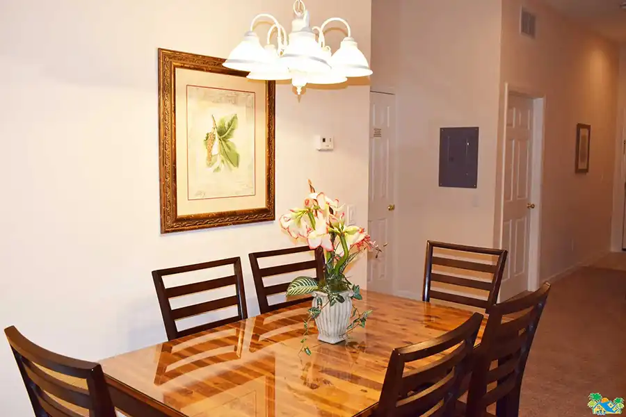 The dining table seats six adults comfortably
