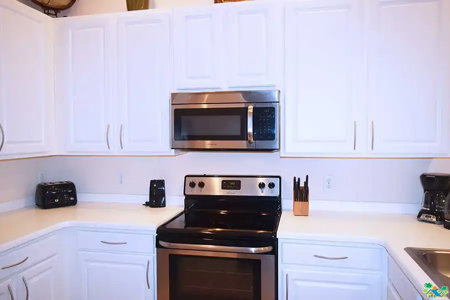 The large glass-top stove and microwave