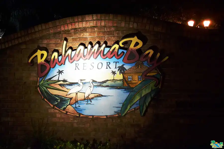 The welcome sign at the Resort entrance at night